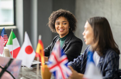 A diverse group of professionals collaborate at a corporate office.